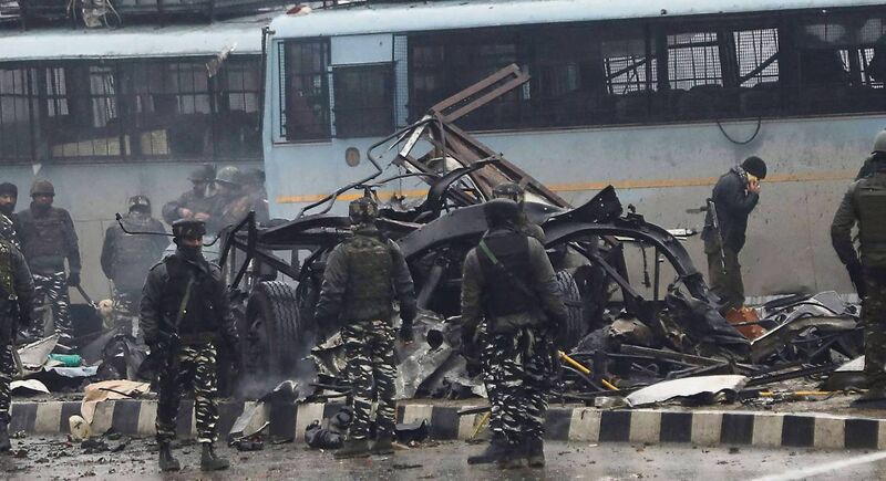 Indian security forces inspect the remains of a vehicle following an attack by terrorist group Jaish-e-Muhammad, led by Pakistani cleric Masood Azha, on a Central Reserve Police Force convoy that killed at least 16 troopers on February 14, 2019.