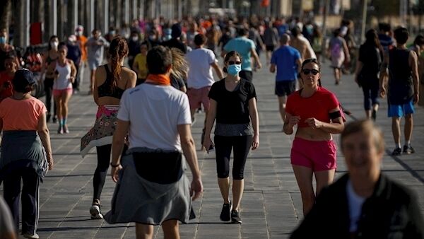 People exercise on Barcelona's seafront promenade today.