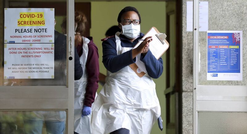 A medical worker sanitises her hands at a testing centre at Tygerberg Hospital in Cape Town, South Africa, Monday, April 6, 2020, as South Africa continued its 21 days nationwide lockdown in an effort to control the spread of the coronavirus.(AP Photo/Nardus Engelbrecht) A medical worker sanitises her hands at a testing centre at Tygerberg Hospital in Cape Town, South Africa, Monday, April 6, 2020, as South Africa continued its 21 days nationwide lockdown in an effort to control the spread of the coronavirus.(AP Photo/Nardus Engelbrecht)
