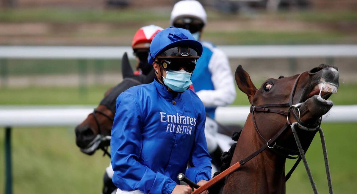 Jockeys wearing protective face masks get ready before the start of Prix d'Escoville race as horse racing resumes behind closed doors at Longchamp in Paris as France softens its strict lockdown rules during the outbreak of the coronavirus disease (COVID-19) in France yesterday. Photo: REUTERS/Gonzalo Fuentes