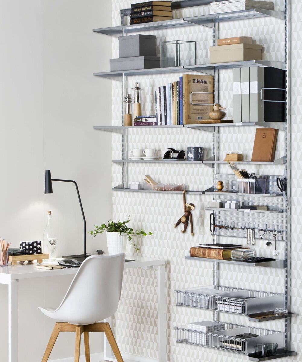 System shelving can deliver a highly tailored hard-working office. Add closed elements to keep things organised, with most of the paperwork and visual stutter of stuff - out of sight. Boxes and wire trays break the load down into logical bites. Elfa, theorganisedstore.ie.