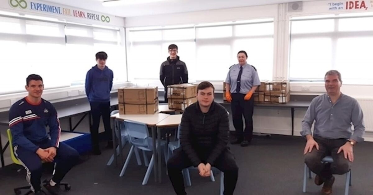 Cork fullback Clancy and Kinsale students producing protective