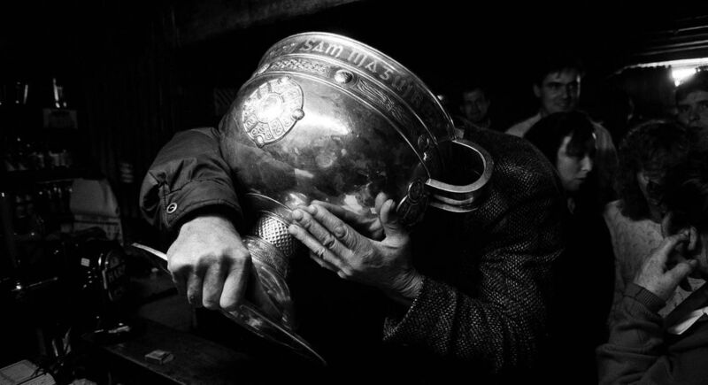 SAFE HANDS: The Sam Maguire trophy doing a tour of the pubs in Donegal after the county’s victory over Dublin in the1992 All-Ireland final. The photo features in Heroes: The best of Inpho sports photography. Picture: INPHO/Billy Stickland SAFE HANDS: The Sam Maguire trophy doing a tour of the pubs in Donegal after the county’s victory over Dublin in the1992 All-Ireland final. The photo features in Heroes: The best of Inpho sports photography. Picture: INPHO/Billy Stickland
