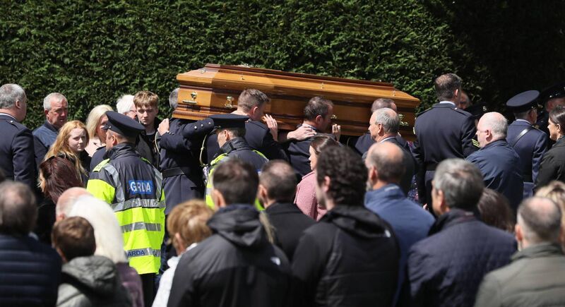 The coffin of Detective Garda Colm Horkan is carried from St James' church to the cemetery in Charlestown, Co Mayo. Picture: Brian Lawless/PA Wire