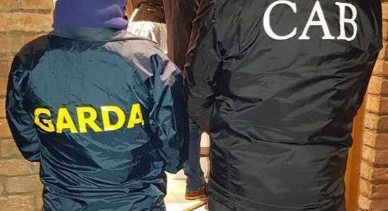 The Criminal Assets Bureau  seized nearly €450,000 in cash together with a string of high-end vehicles and other luxury goods as part of a series of raids in Leinster yesterday morning.