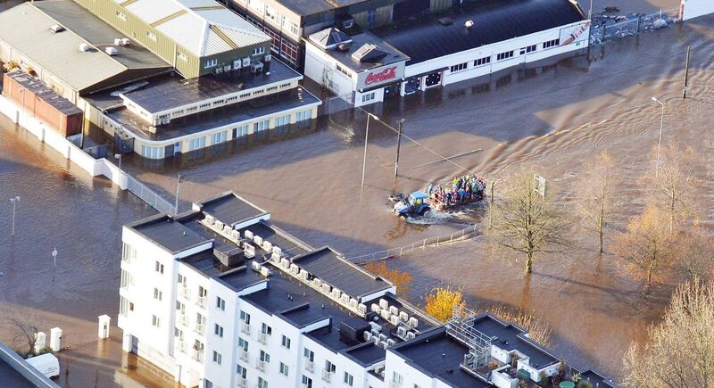 People being transported in towards the city through the flooded Carrigrohane Road, Cork. Picture: Denis Minihane