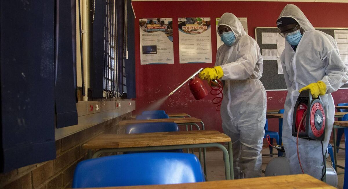 A disinfection team in the classroom at Ivory Park Secondary School east of Johannesburg, South Africa, last month. Pic: AP