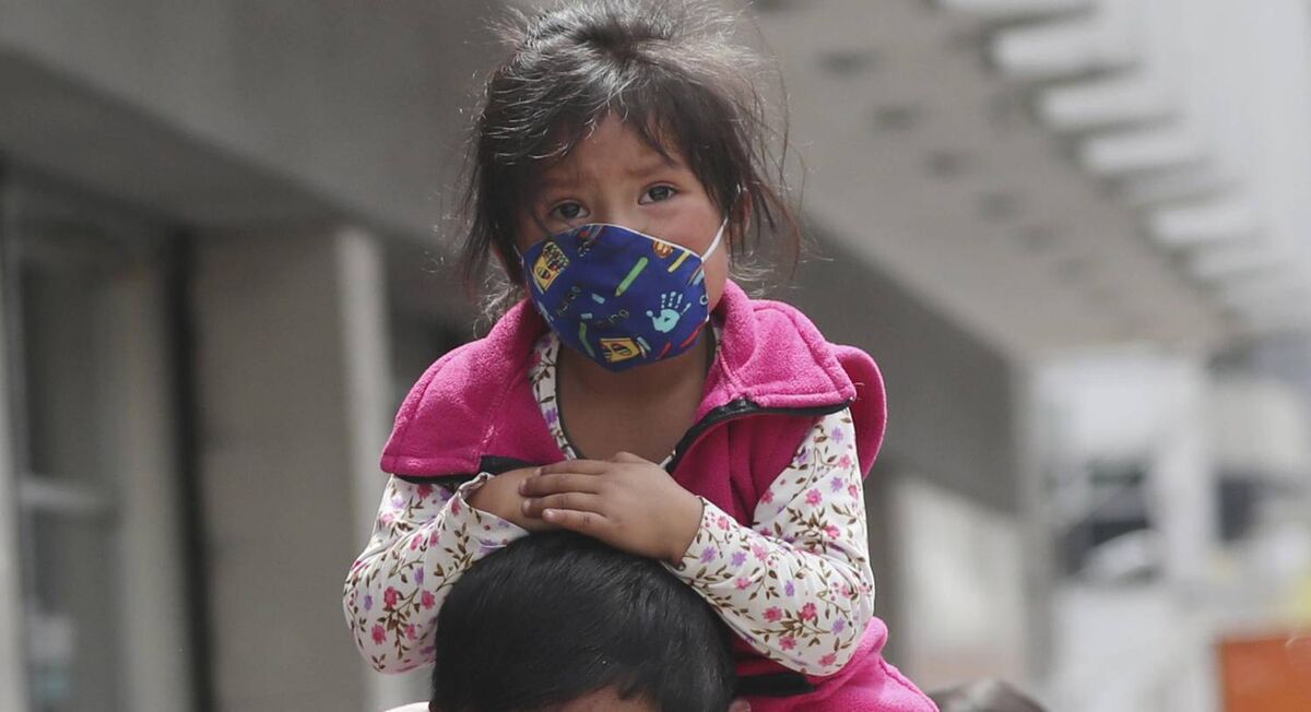 A child wearing a protective face mask as a mandatory measure to help curb the spread of coronavirus in Quito, Ecuador, yesterday. Pic: AP