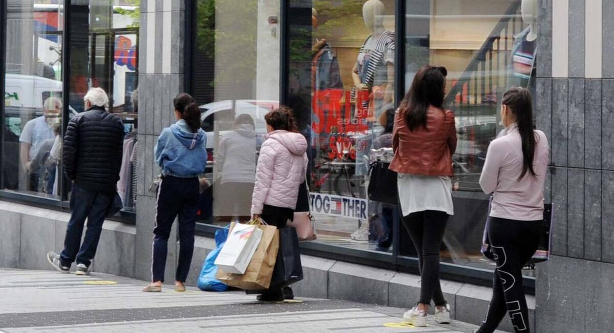 People queuing on Opera Lane in Cork city. Picture Denis Minihane.