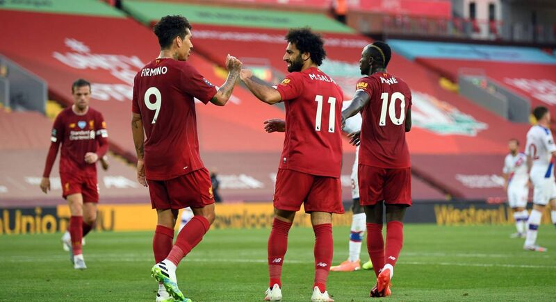 Mohamed Salah celebrates scoring Liverpool's second goal against Crystal Palace with Roberto Firmino and Sadio Mane at Anfield. Picture: Shaun Botterill/NMC Pool/PA Wire
