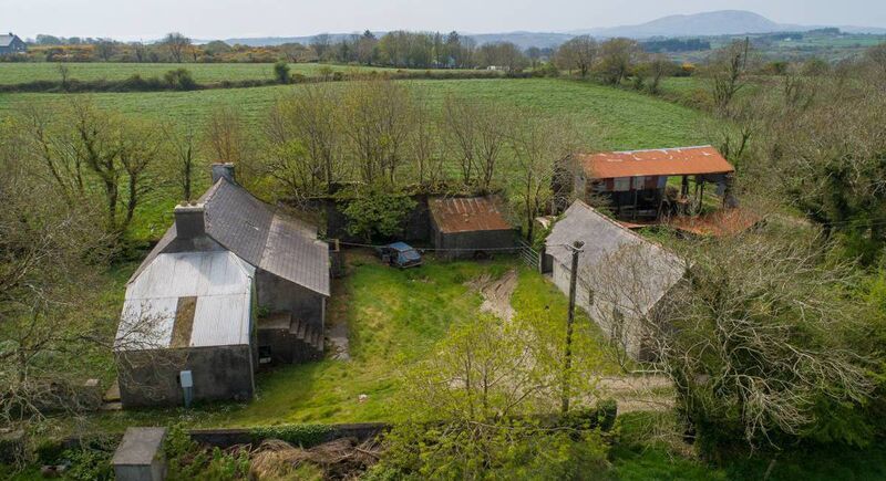 The dwelling and outbuildings on the 66-acre farm for sale at Kilcoe, between Ballydehob and Skibbereen in West Cork.