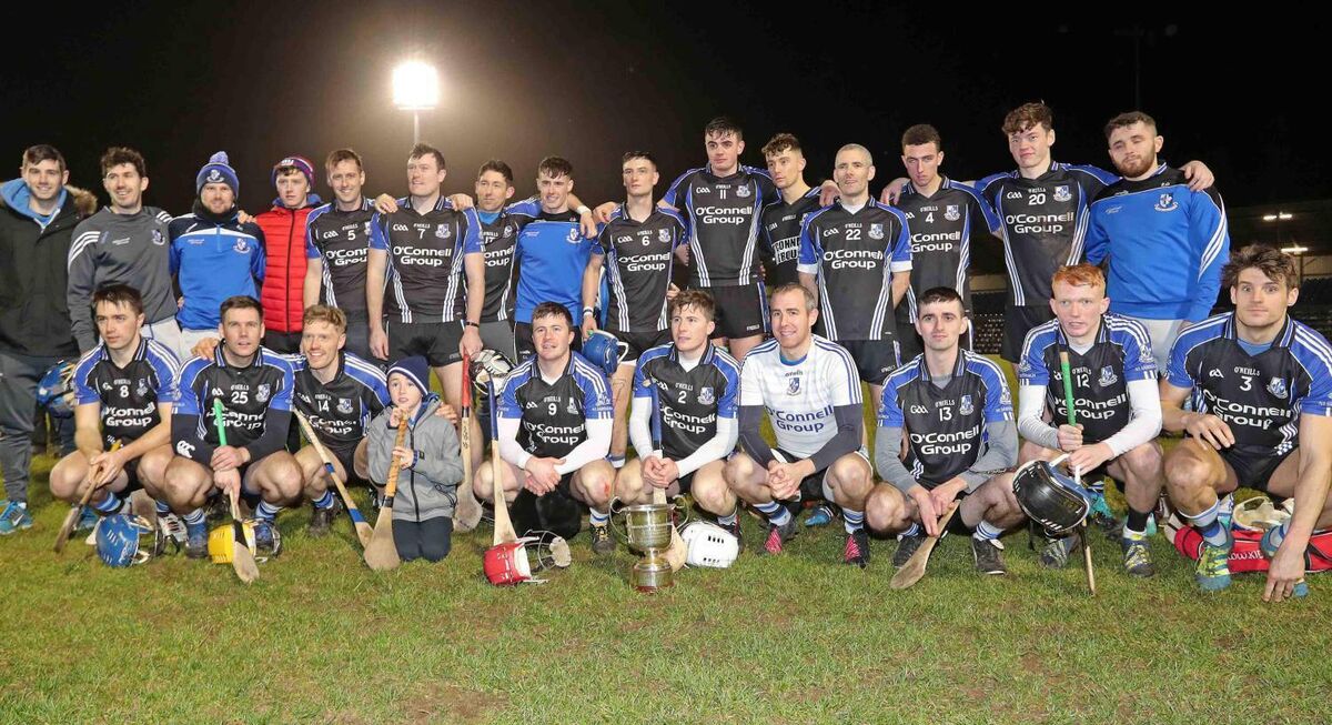 Sarsfields pose with the cup after beating St Finbarr's. Eoin, wearing no. 14, is in the front row, third from the left. Picture: Jim Coughlan