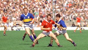 Sean McCarthy keeps possession from Tipperary's Declan Ryan, left, and Pat Fox during the 1990 Munster Senior Hurling Championship final at Semple Stadium, Thurles.