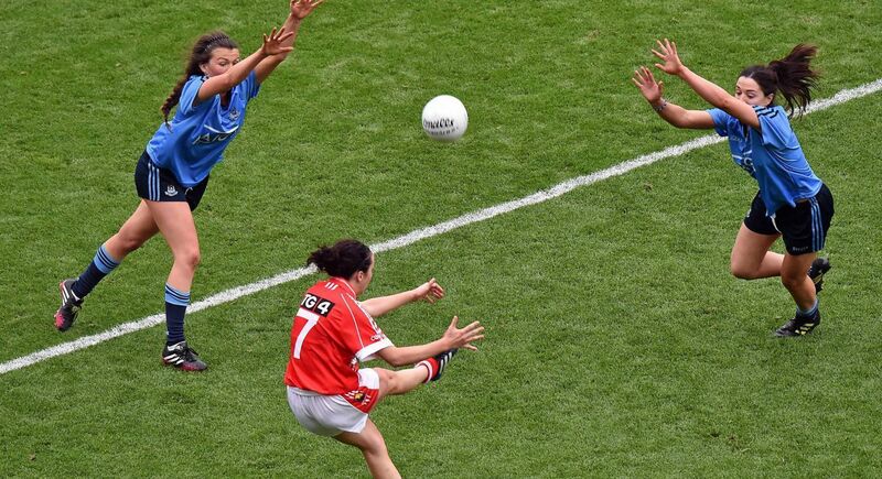 Making a point: Geraldine O’Flynn shoots past Dublin’s Leah Caffrey, left, and captain Sinéad Goldrick to score what proved to be the winning point for Cork in the 2014 TG4 All-Ireland Ladies SFC final in Croke Park. Picture: Ray McManus/Sportsfile