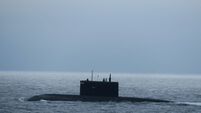 Royal Navy monitors surfaced Russian submarine