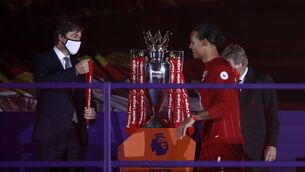 Liverpool's Virgil van Dijk receives his Premier League winners medal Photo: Phil Noble/NMC Pool/PA Wire. 