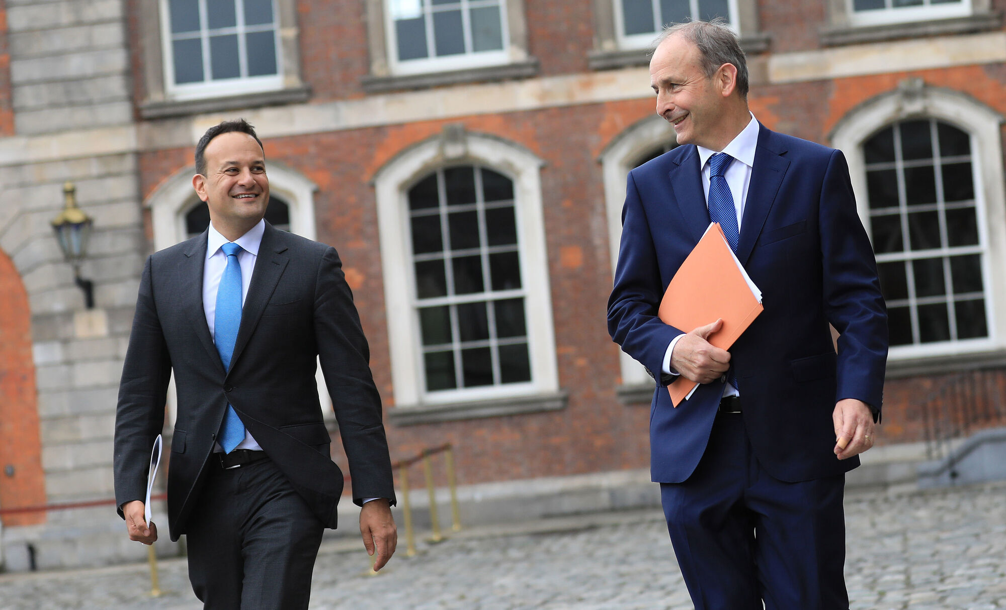 (Left to right) Leo Varadkar and Taoiseach Micheál Martin. The government says it is difficult to put a figure on the levels that might get back to work. Photo: Julien Behal Photography/PA