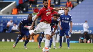 Manchester United's Bruno Fernandes scores his side's first goal of the game from a penalty during the Premier League match at the King Power Stadium, Leicester. 