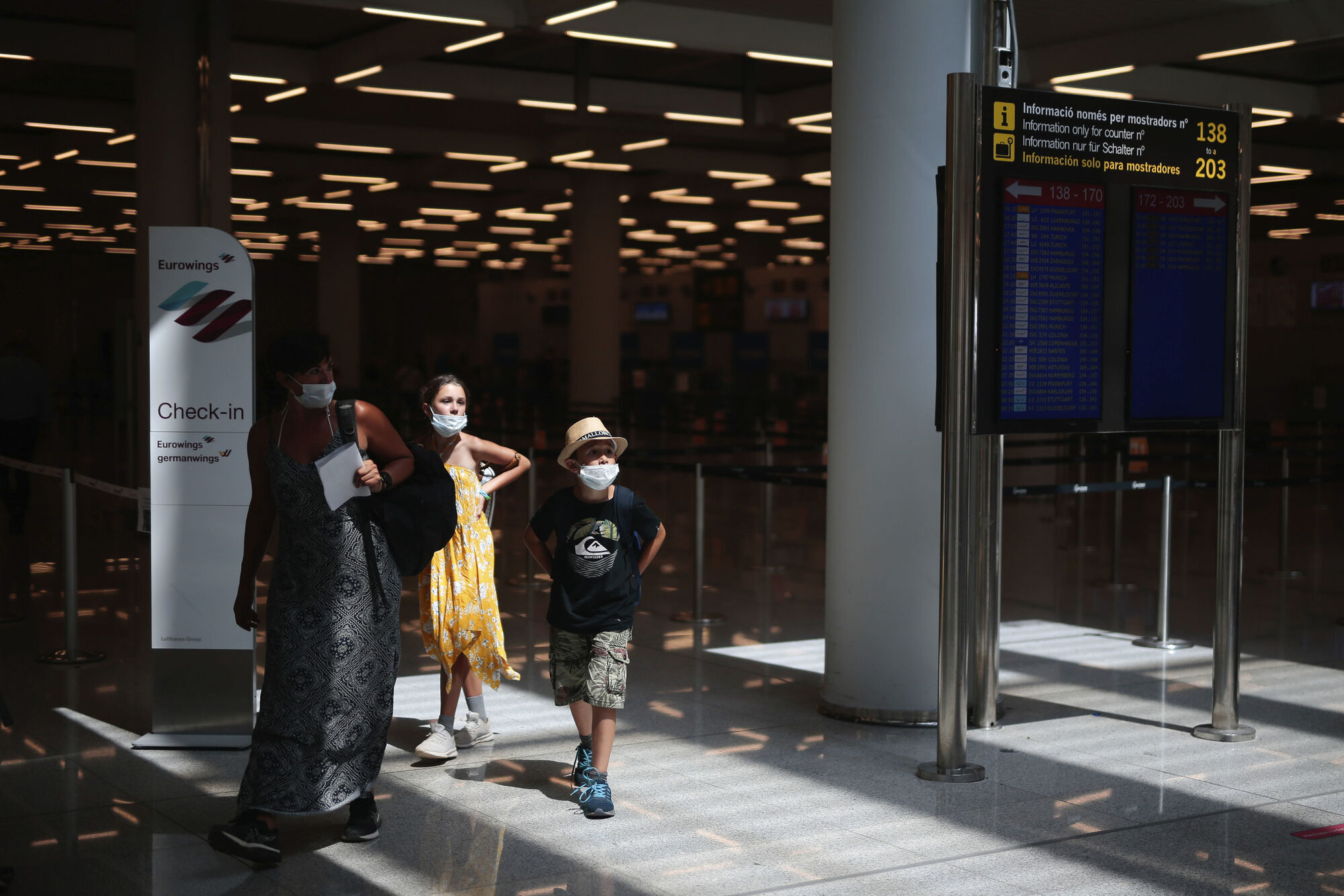 Passengers wearing face masks arrive at Son Sant Joan airport on the Spanish Balearic Island of Mallorca, Spain, Monday, July 27, 2020. Picture: Joan Mateu/AP