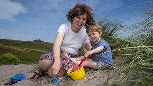 Sharon Ní Chonchúir and son Milo  on the beach near their home in Dingle Co Kerry. Picture: Domnick Walsh 