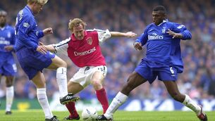 Arsenal's Ray Parlour tussles for a loose ball with Chelsea's Eidur Gudjohnsen and Marcel Desailly during the 2002 FA Cup Final at the Millennium Stadium