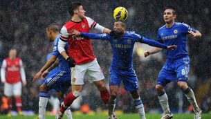 <p>CROSSING THE DIVIDE: Olivier Giroud battles for possession with Ashley Cole and Frank Lampard during a league game in 2013. Cole’s controversial move to Chelsea from Arsenal heightened tensions between the London rivals<span class="contextmenu emphasis CaptionCredit">. Picture: Laurence Griffiths/Getty Images</span>
            </p>