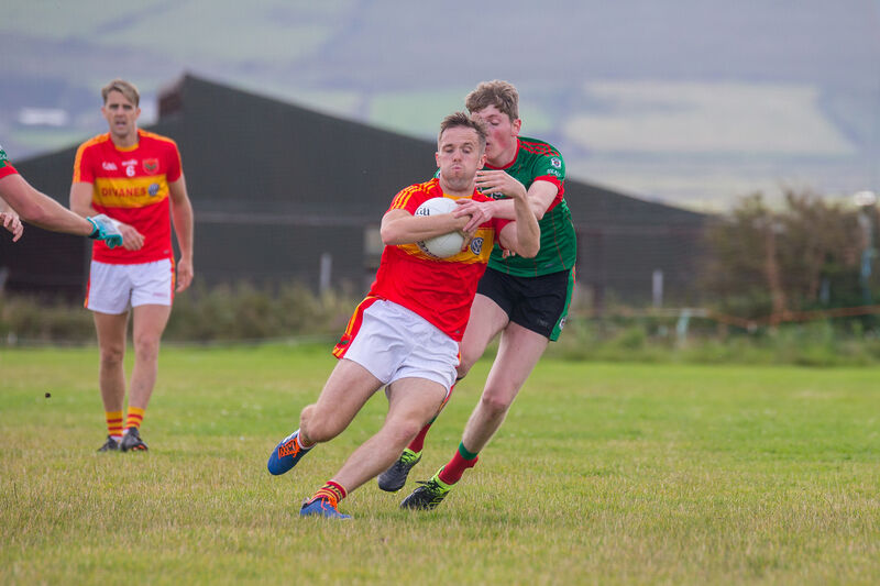 Young Islanders Andy Quigley breaks from the challenge of Beale's Diarmuid O'Mahony. Picture Alan Landers. Young Islanders Andy Quigley breaks from the challenge of Beale's Diarmuid O'Mahony. Picture Alan Landers.