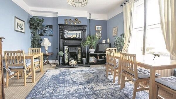 Main downstairs living room complete with Victorian fireplace Main downstairs living room complete with Victorian fireplace