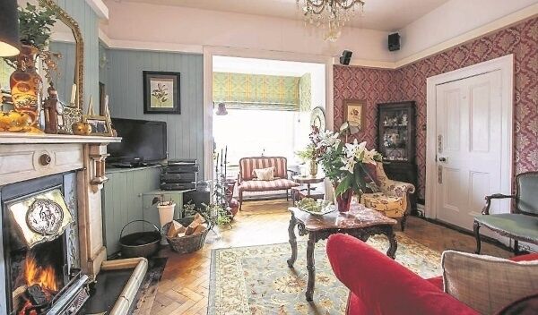 The second downstairs sitting room, which features a mahogany fireplace The second downstairs sitting room, which features a mahogany fireplace