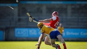 Cuala’s Liam Murphy has his hurley broken by the block of Na Fianna’s Mairtin Quilty. Picture: INPHO/Brian Reilly-Troy