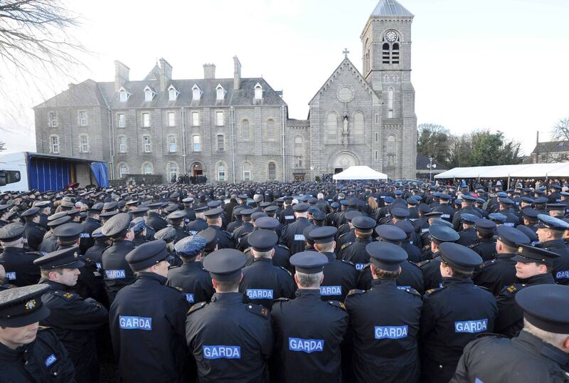 Members of An Garda Siochana gather outside St Joseph's the Redemptorists Church in Dundalk as the funeral of murdered Detective Garda Adrian Donohoe took place. Picture: Laura Hutton/Photocall Ireland