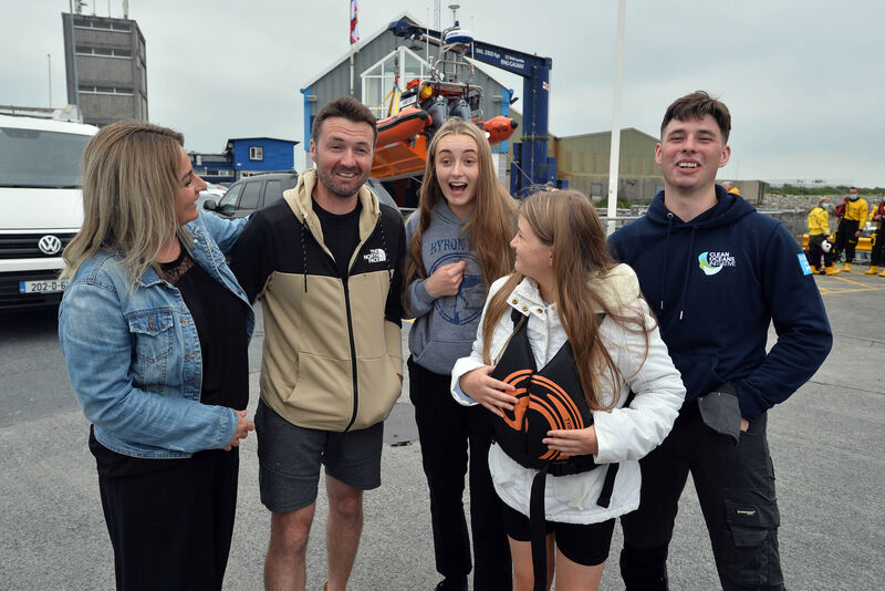 Local fisherman Patrick Oliver with his son Morgan who rescued the two ladies in the sea pictured with their family, Susanne (mother) and sisters Ella and Lilly. Picture: Ray Ryan Local fisherman Patrick Oliver with his son Morgan who rescued the two ladies in the sea pictured with their family, Susanne (mother) and sisters Ella and Lilly. Picture: Ray Ryan