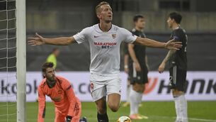 Sevilla's Luuk de Jong celebrates after scoring the winner in Cologne. (Ina Fassbender/Pool Via AP)