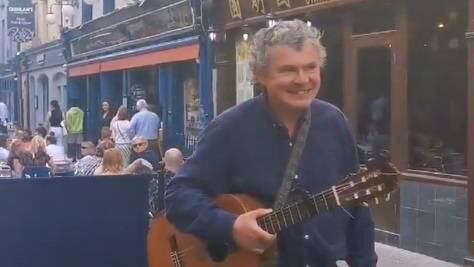 Cork musician John Spillane performing for diners on Princes St. Picture: Nash 19/Twitter