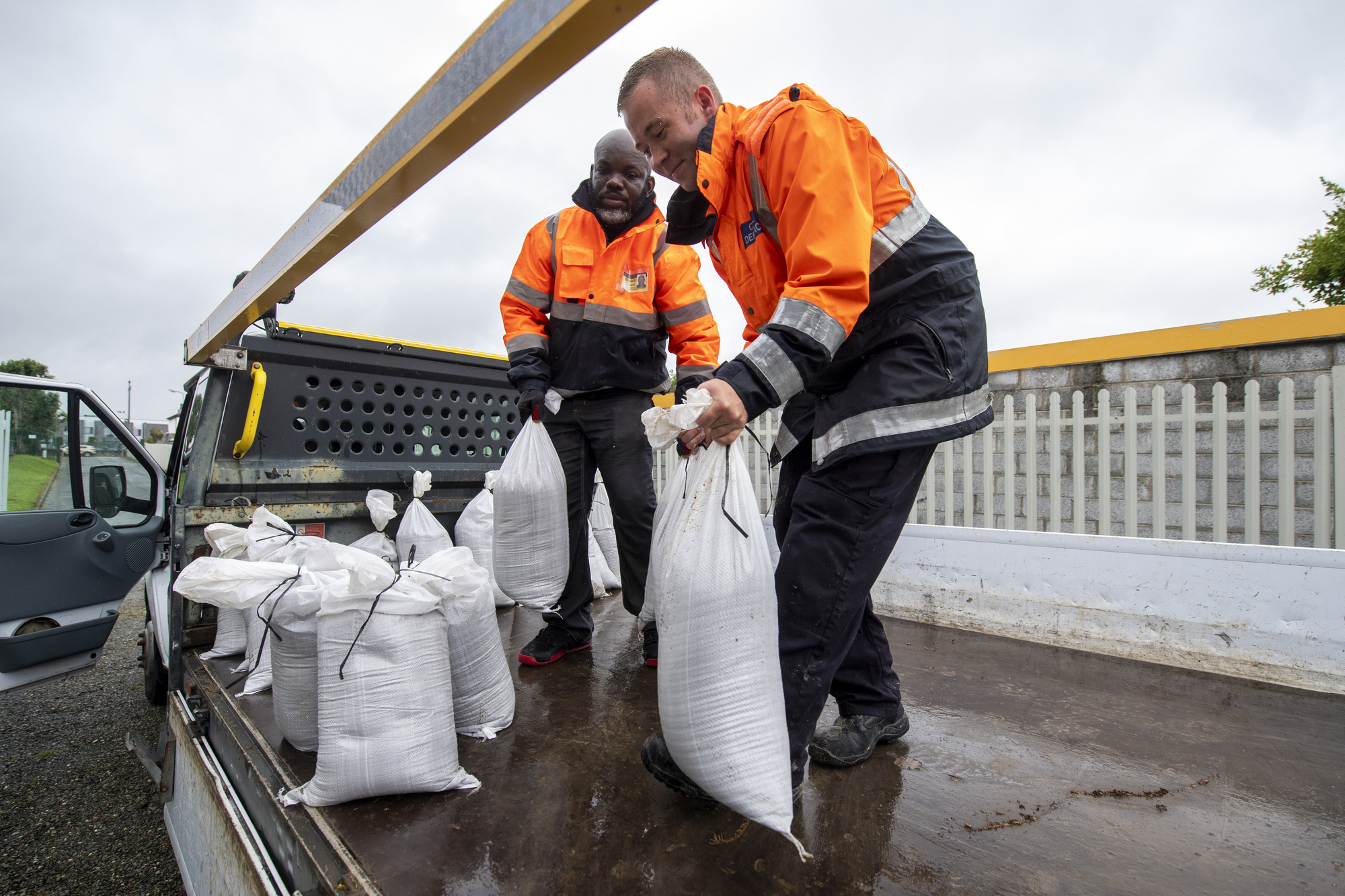 Obi Madichie and Darren O’Callaghan Members of the Kerry Civil Defence were out in force in Tralee filling emergency sandbags for business owners and home owners around Kerry ahead of Storm Ellen. Picture: Domnick Walsh © Eye Focus LTD