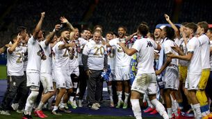 Leeds United manager Marcelo Bielsa with his players as they lift the Sky Bet Championship trophy at Elland Road last month.