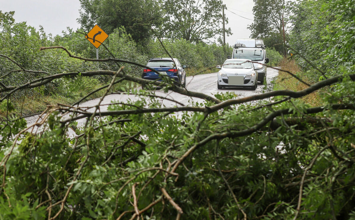 Motorists contend with downed trees on the N72 just outside of Fermoy in County Cork following storm Ellen overnight which left thousands without power, flooding and multiple downed trees across the county. Picture: Damien Storan/PA Wire