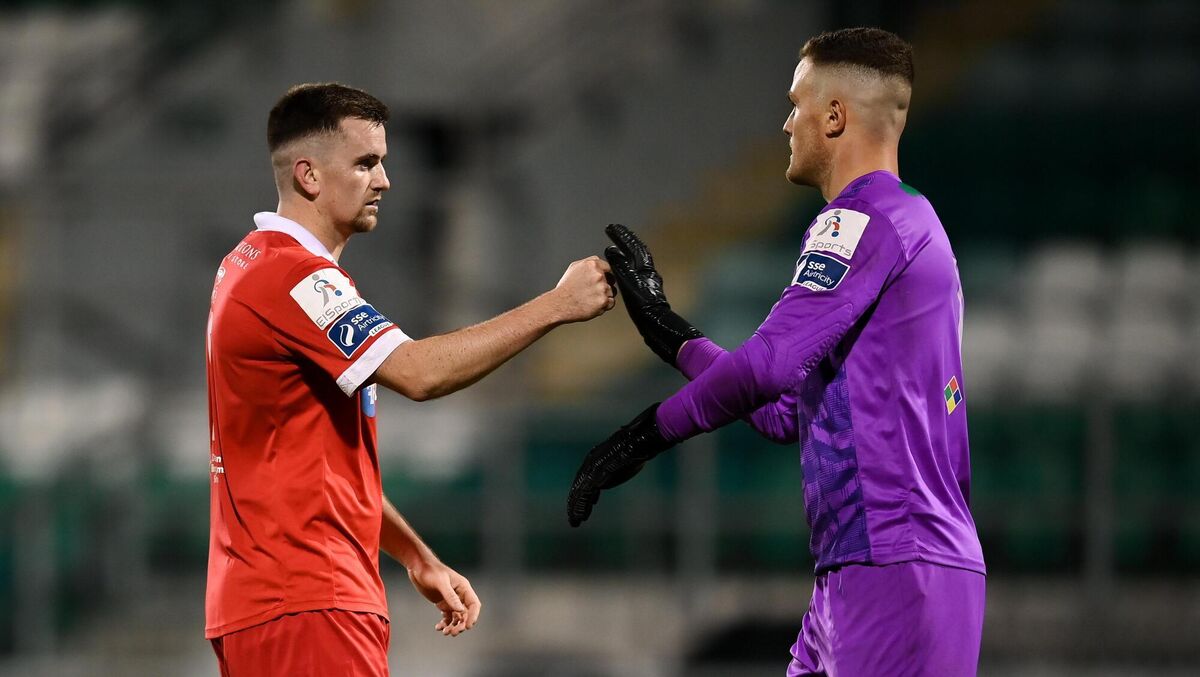 Shelbourne's Dan Byrne and goalkeeper Colin McCabe after the game Shelbourne's Dan Byrne and goalkeeper Colin McCabe after the game