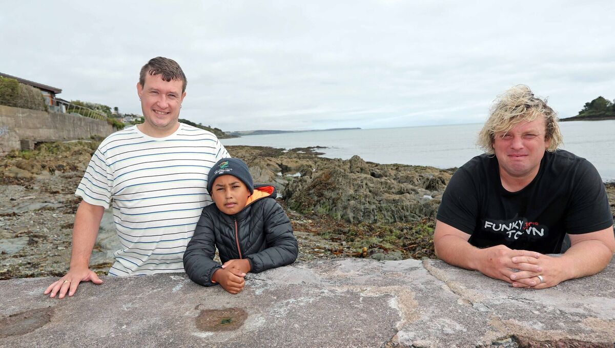 Rescued from the water, Damien and Muruthi O'Donovan, from Dunkettle with Paddy Quinlan. Picture: Jim Coughlan. Rescued from the water, Damien and Muruthi O'Donovan, from Dunkettle with Paddy Quinlan. Picture: Jim Coughlan.