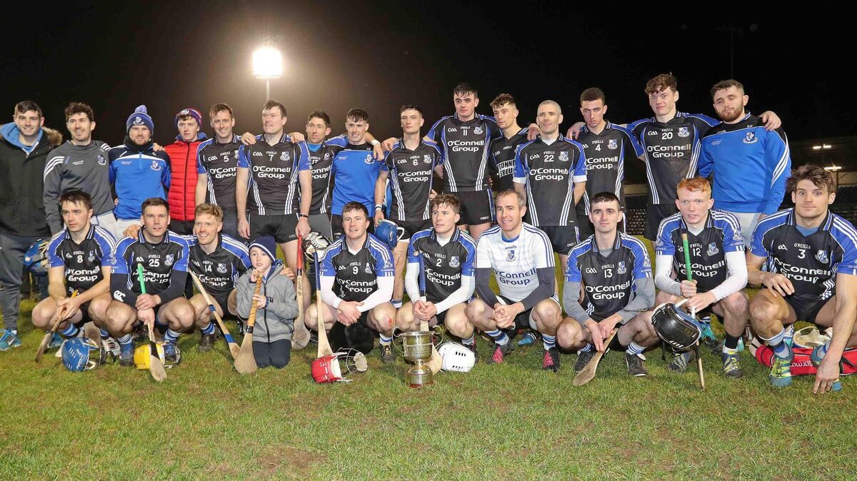 Sarsfields pose with the cup after beating St Finbarr's. Eoin, wearing no. 14, is in the front row, third from the left. Picture: Jim Coughlan