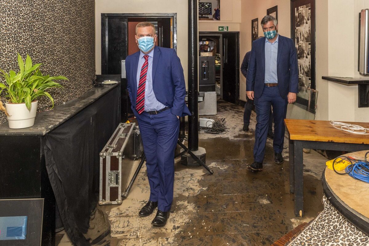 The Minister for Public Expenditure, Michael McGrath TD, visited Bantry to see the flood damage caused by Storm Francis on Monday last. Mr McGrath views the damage to the Cosy Cabin pub, which was under 5ft of water in Monday night's flood. Looking on is Christopher O'Sullivan TD. Picture: Andy Gibson