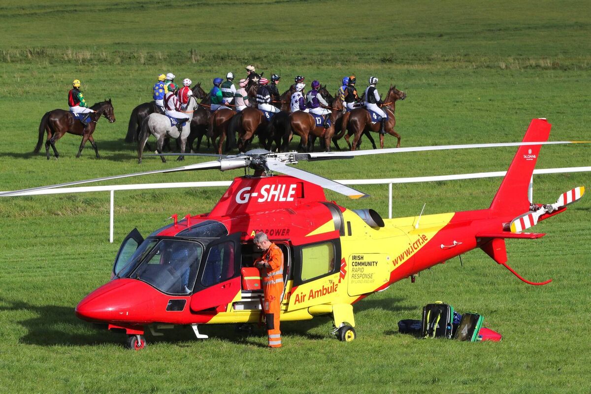 The Irish Community Rapid Response air ambulance HeliMed92 on the racetrack in Thurles last October as its crew prepared to airlift jockey David Mullins to hospital in Cork after he suffered spinal injuries in a fall. Picture via Twitter: The Irish Horseracing Regulatory Board