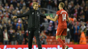 <p>Liverpool manager Jurgen Klopp celebrates a victory with Jordan Henderson</p>