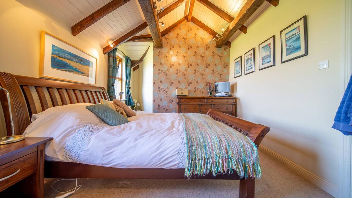 A bedroom in the original house section