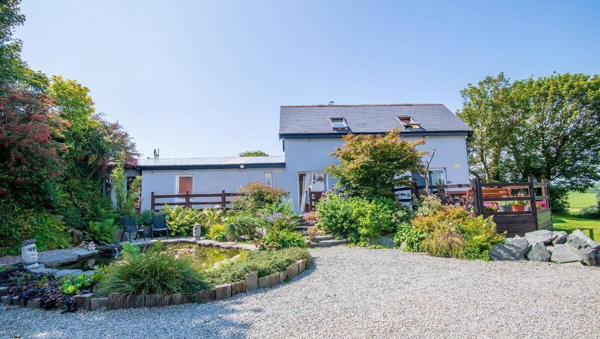 Self-contained apartment next to outbuildings
