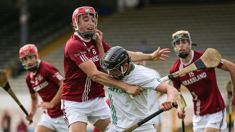 O'Loughlin Gaels’ Mikey Butler fends off Chris Kavanagh of Dicksboro. Picture: INPHO