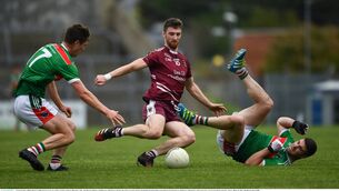 <p>Lissycasey's Brian Cahill in action against Andrew Shannon, left, and Darren Hickey of Kilmurry Ibrickane at Cusack Park, Ennis. Photo by Ray McManus/Sportsfile</p>