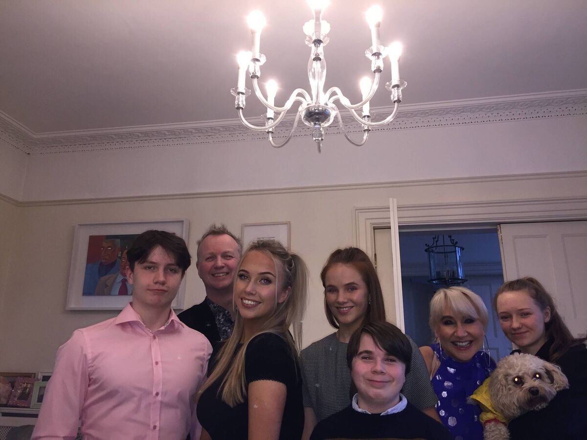Aileen Hickie and Matt Cooper with, from left, Zach, Andie, Aimee, Harry and Millie with dog Scout.