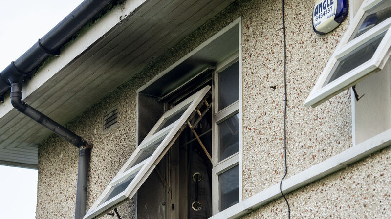 Woman and her children jump to safety after fire at their house