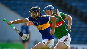 <p>Alan Flynn of Kiladangan in action against Brian McGrath of Loughmore-Castleiney. Photo by Ray McManus/Sportsfile</p>